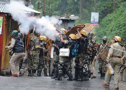 Security forces fire teargas canisters during clashes with supporters of the separatist Gorkha Janmukti Morcha (GJM) group in Darjeeling yesterday.