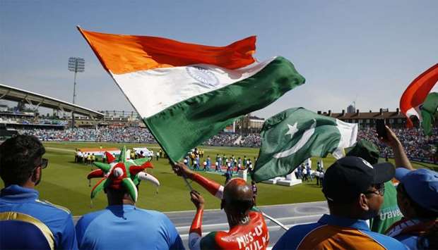 India and Pakistan fans wave flags as the players walk out before the match