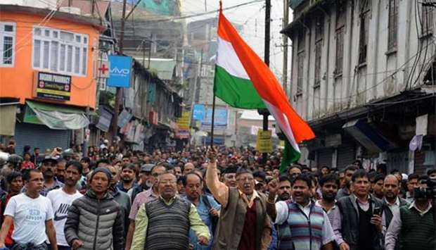 Supporters of the separatist Gorkha Janmukti Morcha (GJM) group take part in a rally to honour protesters that GJM leaders say had been killed during clashes with security forces a day earlier, in Darjeeling on Sunday.