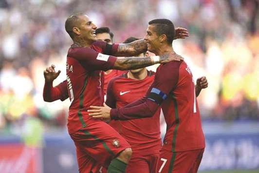 Portugal forward Ricardo Quaresma (left) celebrates his goal with teammate Cristiano Ronaldo (right) during their Confederations Cup match against Mexico in Kazan, Russia, yesterday. (AFP)