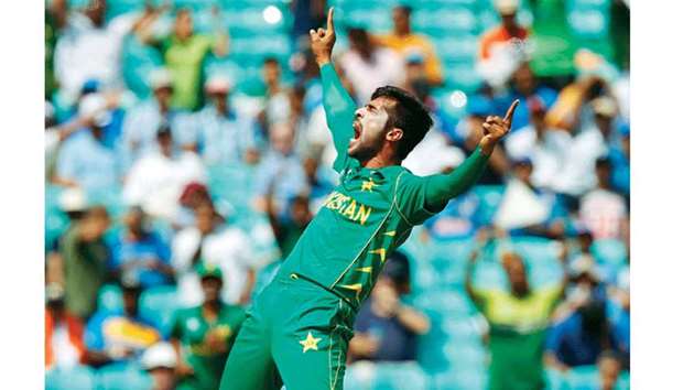 Pakistanu2019s Mohamed Amir celebrates taking the wicket of Indiau2019s Rohit Sharma  during the ICC Champions Trophy final yesterday. (AFP)
