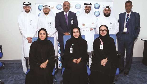 Programme participants with QIB officials.