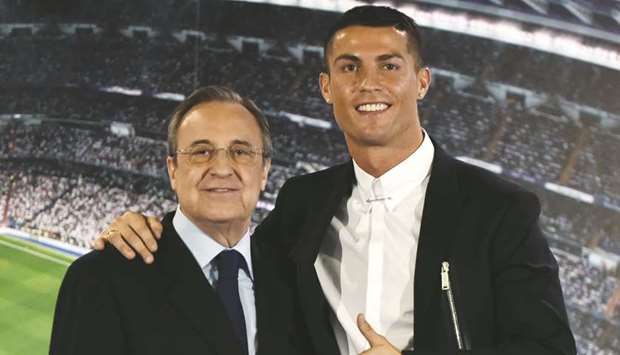 Real Madridu2019s Cristiano Ronaldo and club president Florentino Perez (left) pose after the star forward signed a contract renewal in Novemeber 2016. (AFP)