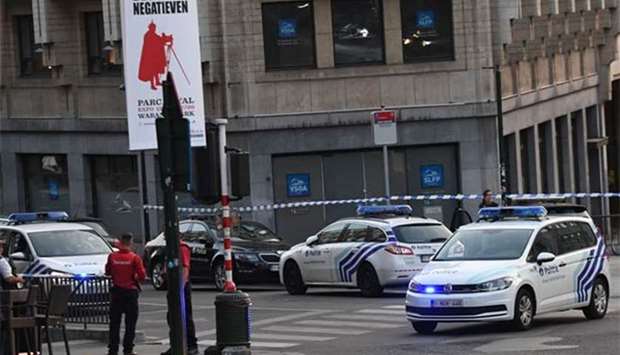 Police vehicles cordon off an area outside Gare Central in Brussels on Tuesday, after an explosion in the Belgian capital.