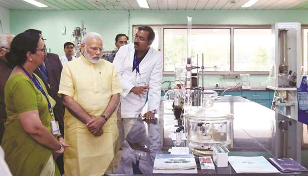 Prime Minister Narendra Modi visits the Central Drug Research Institute in Lucknow yesterday. During his 40-minute stay at the institute, Modi toured its two laboratories and expressed keen interest in the research work.