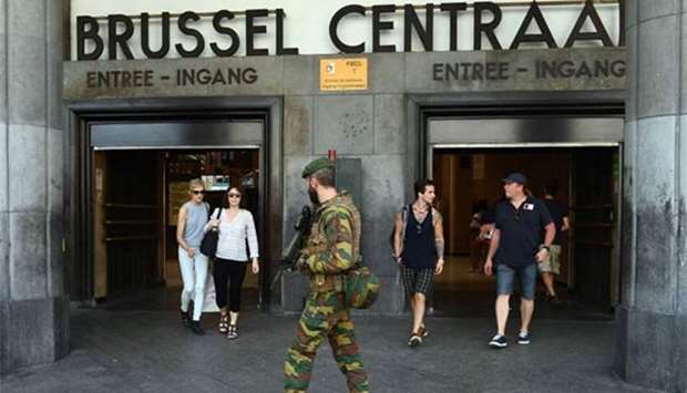 A  Belgian soldier patrols around the Central train station in Brussels on Wednesday following a failed terrorist bomb attack a day earlier.