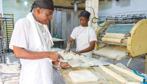 Bonaventure Boma prepares bread in his bakery in Lome.