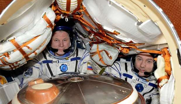 ESA French astronaut Thomas Pesquet (R) with Russian commander Oleg Novitsky