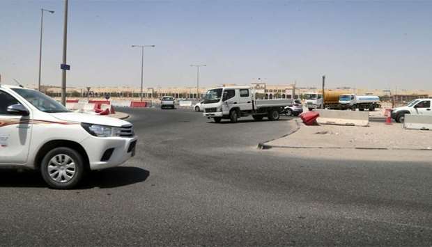A light truck (centre) making an illegal U-turn at a roundabout in the Doha Industrial Area. PICTURE: Jayan Orma.