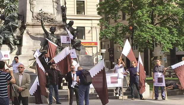 The demonstrators raised Qatari flags and banners bearing slogans calling for an end to the blockade that has been imposed on Qatar by Saudi Arabia, the UAE and Bahrain for more than two weeks.