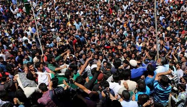 Kashmiri villagers carry the body of protester Tawseef Ahmed during his funeral procession at Pulwama, south of Srinagar, on Thursday.