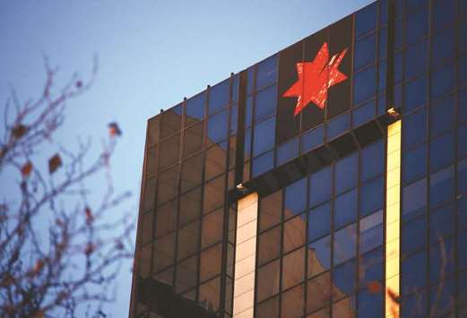 The logo of National Australia Bank adorns their headquarters building in central Sydney. An Australian state imposed a surprise tax on the countryu2019s five biggest banks, a move that comes on top of a new $4.6bn federal levy u2013 prompting predictions that other states could follow suit and howls of outrage from the sector.