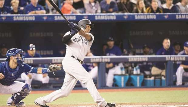 New York Yankees left fielder Aaron Hicks (31) hits a three run double in the first innings against the Toronto Blue Jays at Rogers Centre in Toronto, Ontario, on Thursday. (USA TODAY Sports)