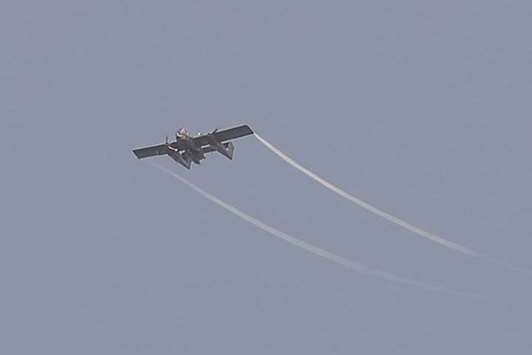 An Air Force OV-10 bronco plane flies during an aerial bombing of a militant position in Marawi.