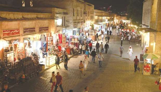 Visitors walk past stores in Souq Waqif in Doha. Although Qatar is preparing to introduce a GCC-wide value-added tax in 2018, BMI believes that the inflationary impact of this measure would be relatively limited, given its small size (5%) and the fact that many food items and essential services (including education) would be exempt.
