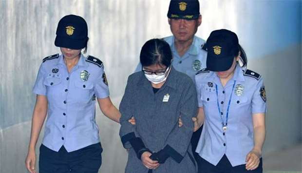 Choi Soon-sil, the woman at the centre of the South Korean political scandal and long-time friend of former president Park Geun-hye, arrives at a court in Seoul on Friday.