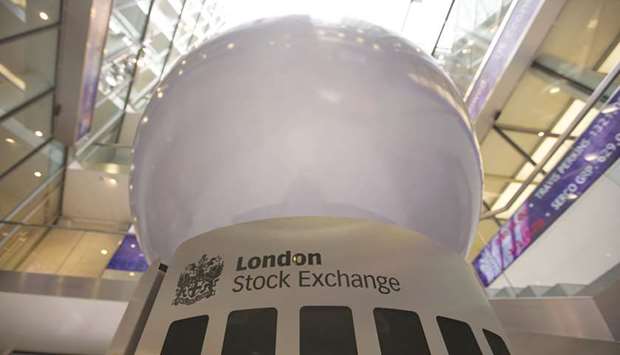 A logo is displayed on an interactive sculpture in the main atrium of the London Stock Exchange headquarters. The FTSE 100 closed down 0.2% to 7,424.13 points yesterday.