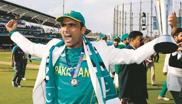 File picture of Pakistanu2019s Fakhar Zaman holding the trophy as he celebrates with Pakistan players on the pitch after the ICC Champions Trophy final against India.