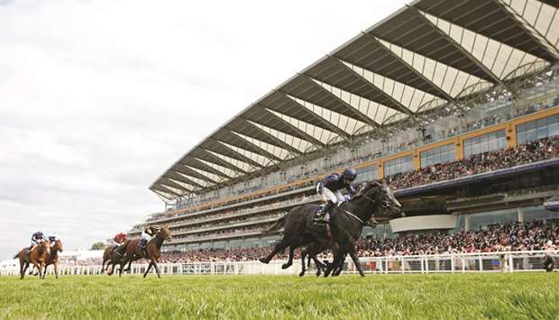Ryan Moore (right) rides Caravaggio to victory in the Commonwealth Cup at Ascot, United Kingdom, yesterday. (Reuters)