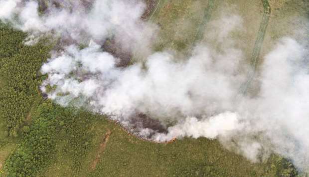 A picture taken yesterday in Liessel shows an aerial view of the fire at Deurnese Peel National Park.