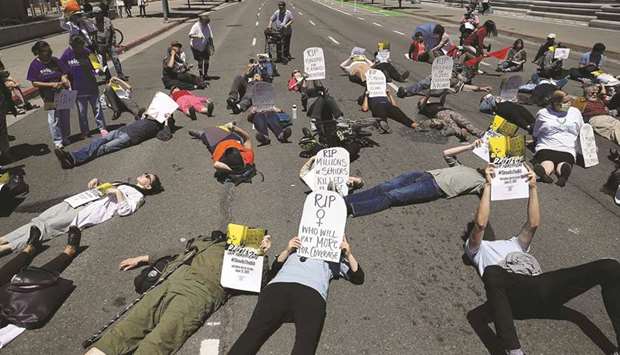 This picture taken on Wednesday shows activists staging a die-in in San Francisco to protest the u2018Trumpcareu2019 bill.