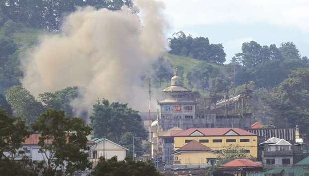 Smoke is seen after an OV-10 Bronco aircraft released a bomb during an air strike, as government troops continue their assault against insurgents from the Maute group in Marawi city, yesterday.