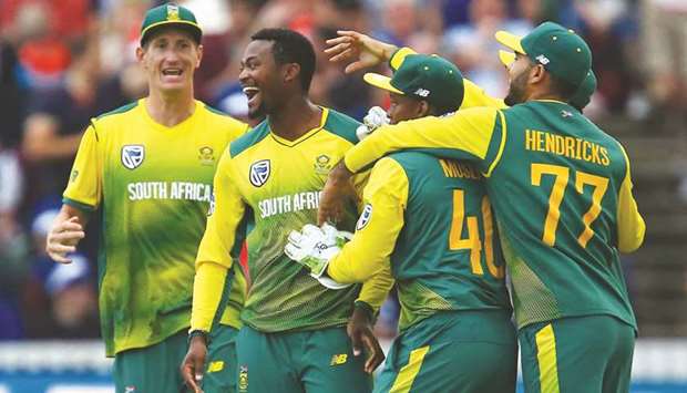 South Africau2019s Andile Phehlukwayo (2nd L) celebrates with teammates after sealing victory with the final ball of the second T20 between England and South Africa at The Cooper Associates County Ground in Taunton, south-west England yesterday.