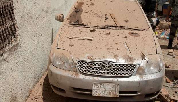 A damaged car is seen after a suicide bomber blew himself up in Mekkah, Saudi Arabia