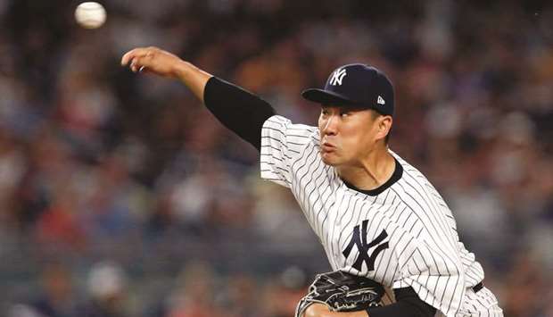 Masahiro Tanaka of the New York Yankees pitches against the Texas Rangers on Friday.