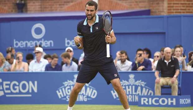 Croatiau2019s Marin Cilic celebrates after winning the match point against Luxembourgu2019s Gilles Muller during the semi-finals at Queenu2019s Club in London yesterday. (Reuters)