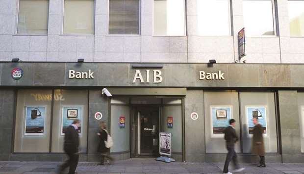 Pedestrians pass a branch of the Allied Irish Bank in Dublin. The initial public offering of 25% of AIBu2019s shares at u20ac4.40 each was the third largest European bank listing since the financial crisis and the biggest IPO of any kind in London by market capitalisation in almost six years.