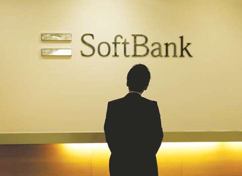 A man looks at the logo of SoftBank Group at the companyu2019s headquarters in Tokyo. SoftBanku2019s Vision Fund, which has attracted investment from the Public Investment Fund of Saudi Arabia, Apple and other large institutional backers, is investing in  cutting edge technologies from virtual reality to the Internet of Things.