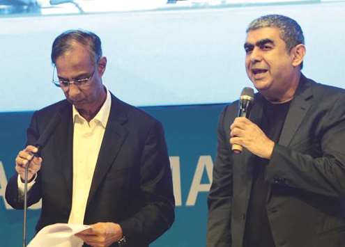 Infosys CEO and managing director Vishal Sikka (right) and board chairman S Seshasayee during the companyu2019s annual general meeting in Bengaluru on Saturday.