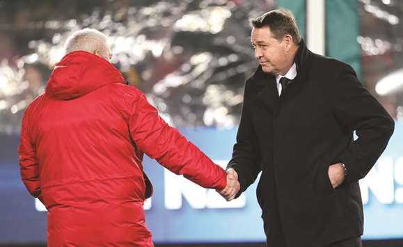 Lions coach Warren Gatland (L) and New Zealand All Blacks coach Steve Hansen (R) shake hands bat Eden Park in Auckland on Saturday.
