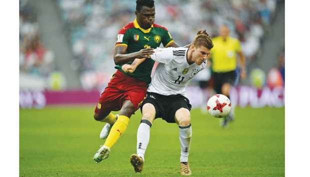 Germanyu2019s forward Timo Werner (right) vies for the ball with Cameroonu2019s defender Ernest Mabouka during the Confederations Cup group B match at the Fisht Stadium Stadium in Sochi, Russia, yesterday. (AFP)