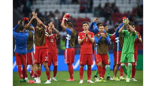 Russiau2019s forward Dmitry Poloz (left) and his teammates acknowledge the fans after they lost to Mexico in the Confederations Cup group A match in Kazan on Saturday. (AFP)