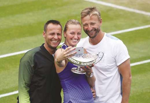 Czech Republicu2019s Petra Kvitova (centre) celebrates with the trophy and her coach Jiri Vanek (right) after winning the final against Australiau2019s Ashleigh Barty at the WTA Aegon Classic in Birmingham yesterday. (Reuters)