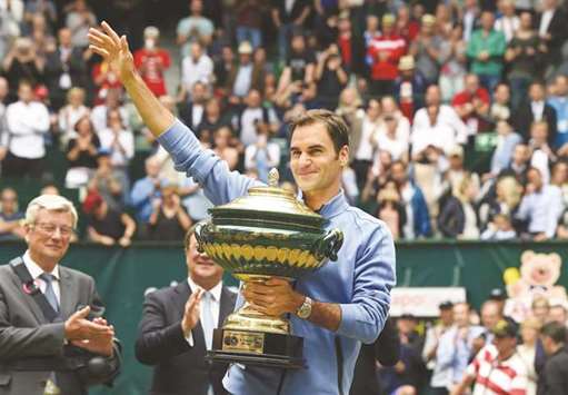 Roger Federer poses with his trophy after winning his final against Alexander Zverev in Halle, Germany, yesterday. (AFP)