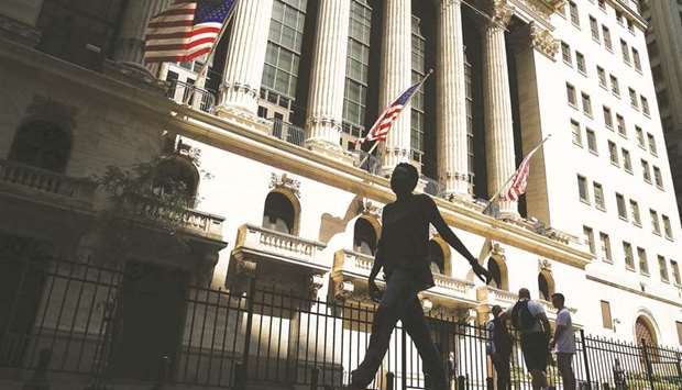 People walk by the New York Stock Exchange. Thereu2019s plenty of uncertainty about health policy in Washington, but on Wall Street, investors have a clear hunger for health stocks.
