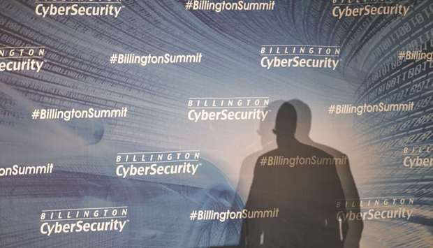 The shadow of Thomas u201cTomu201d Kirchmaier, vice president of special projects at General Dynamics Corp, is seen as he speaks during the Billington Global Automotive Cybersecurity Summit at the Cobo Center in Detroit, Michigan on July 22, 2016. The wake-up call for cyber security expertise during mergers and acquisitions came after a 2014 Yahoo! hack affected about 500mn accounts, damaging the companyu2019s reputation and causing Verizon Communications to cut its offer to buy the company by $350mn.