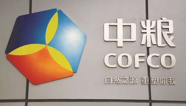 The company logo of China Oil and Foodstuffs Corporation is seen at its headquarters in Beijing. Sources with knowledge of COFCOu2019s expansion strategy say the state-run conglomerate is struggling to integrate businesses it bought three years ago, deals which made it a significant global agricultural trader but are now hindering its ability to swoop on rivals.