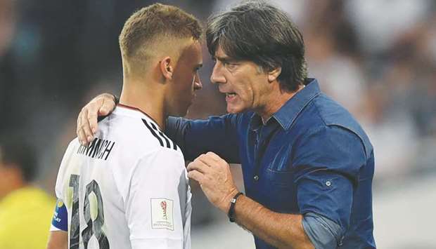 Germanyu2019s coach Joachim Loew (right) speaks to defender Joshua Kimmich during the Confederations Cup group B match against Cameroon at the Fisht Stadium Stadium in Sochi, Russia, on Sunday. (AFP)