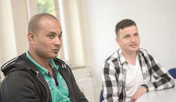 Abdelkader Mohamed, from Egypt, and Mohamed Barkel, from Syria, are both enrolled on programmes at the LEB centre in Hanover, which helps prepare refugees for the German job market.