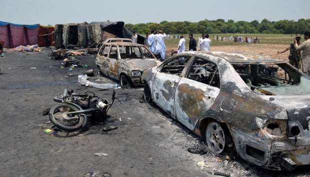 Burnt out cars and motorcycles are seen at the scene of an oil tanker explosion in Bahawalpur, Pakistan. Reuters