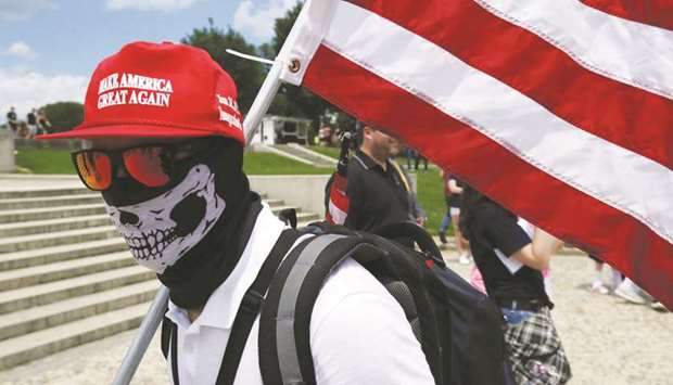 A masked demonstrator at a rally by self proclaimed White Nationalists, white supremacists and Alt-Right activists for what they called a Freedom of Speech rally at the Lincoln Memorial in Washington.