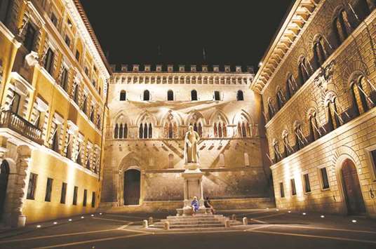 The entrance of Monte dei Paschi di Siena banku2019s headquarters is seen in Italy. Up to u20ac70bn in sales are now in the pipeline, driven by ECB-enforced clean-ups at Monte dei Paschi and the two Veneto lenders.
