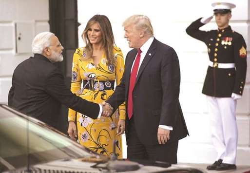 US President Donald Trump and First Lady Melania Trump bid farewell to Indian Prime Minister Narendra Modi on the South Lawn of the White House in Washington. Trump said at a joint public appearance with Modi after the leaders met on Monday that their two countries must have u201ca trading relationship that is fair and reciprocalu201d and u201cit is important that barriers be removedu201d to US exports to India.