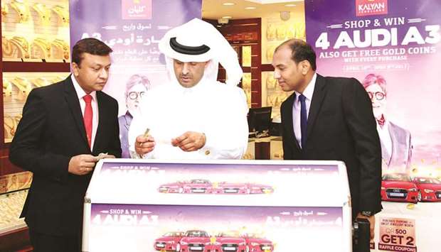 Ejayan Ali Almarri, chief of field control at the Ministry of Economy and Commerceu2019s Quantitative Licences and Market Control department, conducted the raffle draw in the presence of Prajeesh Ramachandran, general manager of Kalyan Jewellers, Qatar, and Sumesh T, regional manager of Kalyan Jewellers, Qatar.