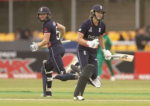 Englandu2019s Natalie Sciver (right) runs a single to complete her century as teammate Heather Knight looks on during their Womenu2019s World Cup match against Pakistan in Leicester, England, yesterday. (Reuters)