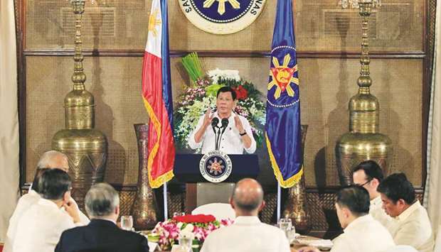 President Rodrigo Duterte gestures as he addresses Filipino-Muslim leaders during an Eid al-Fitr celebration at the Malacanang Presidential Palace in Metro Manila, yesterday.